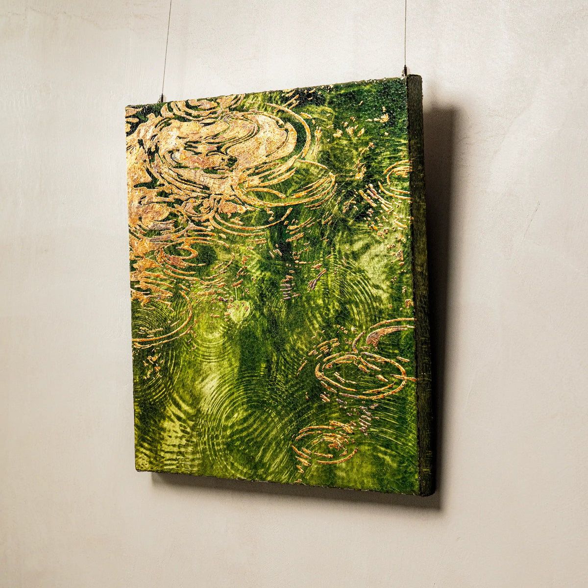 Macro detail of Early Spring and Ripples Fired Foil Handcrafted Art, where heat-colored foil traces catch and release warmth as the viewing angle shifts, alive against the cool blue-green 3D textured mineral terrain beneath.