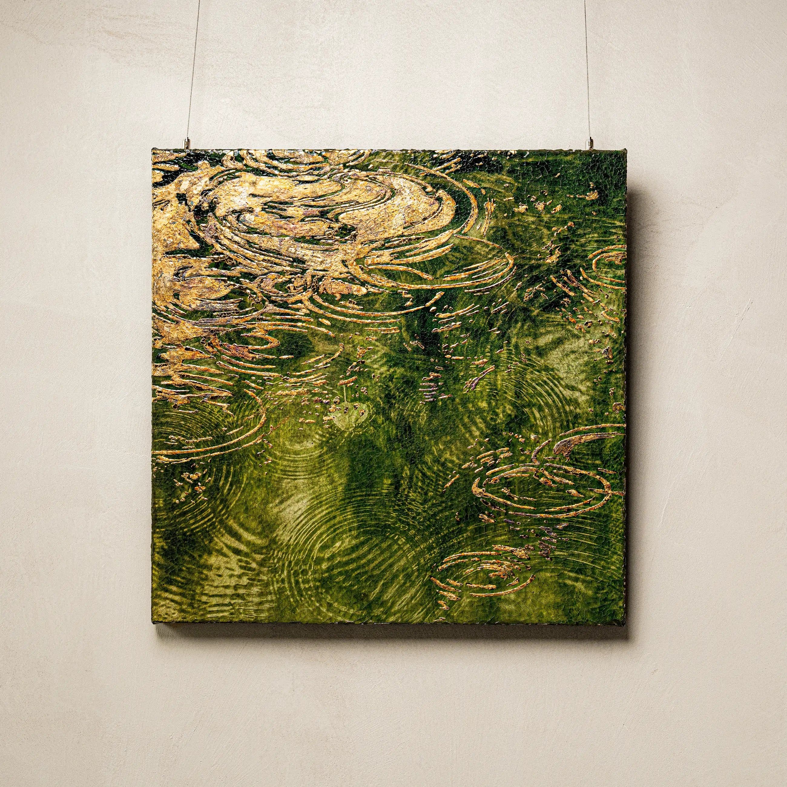 Early Spring and Ripples Fired Foil Handcrafted Art — full view of a water element wall art with outward-spreading 3D wave ripple texture built on a deep blue-green granular mineral ground, evoking still water at the moment spring arrives.