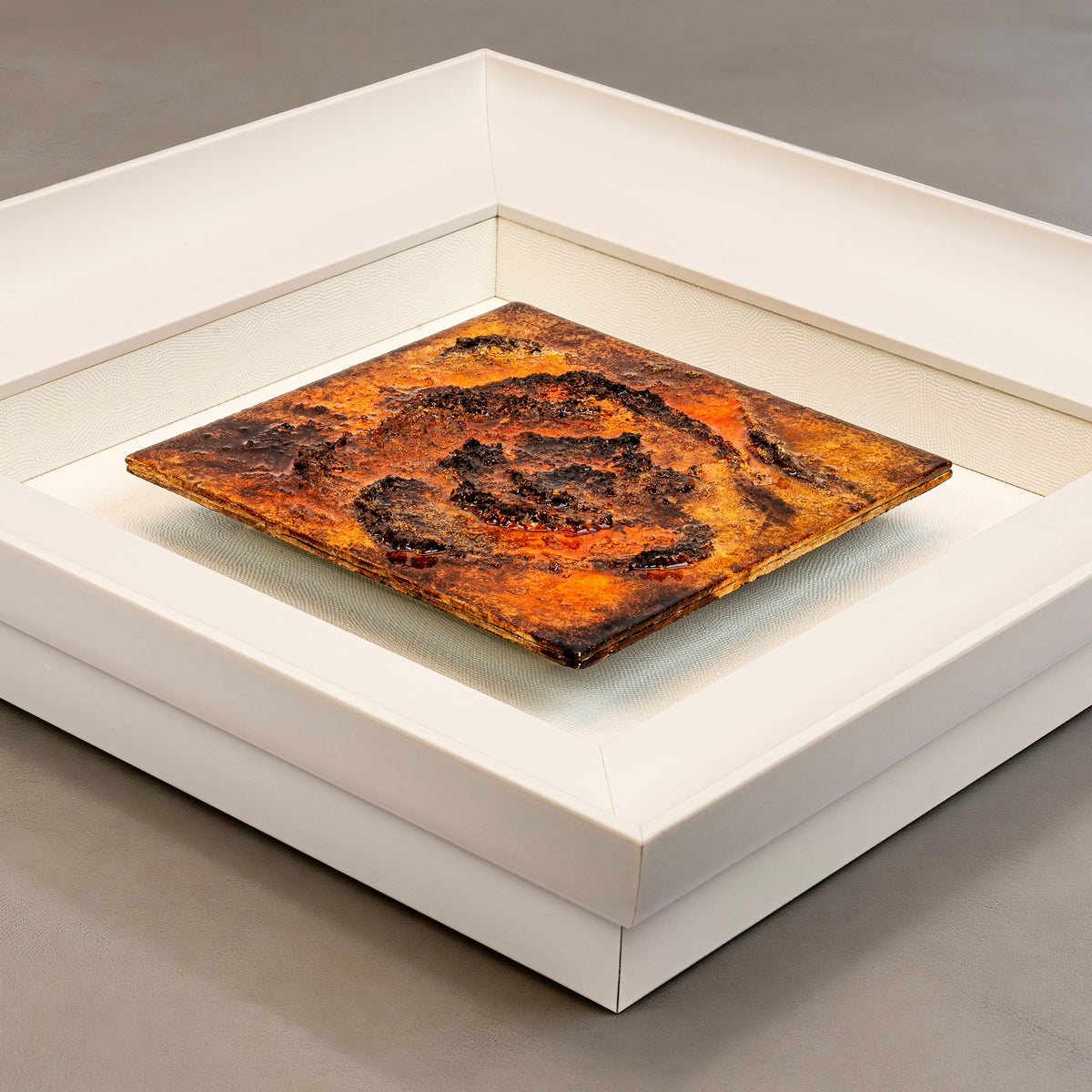 Flat-lay overhead view of Fervor — Mineral Texture · Aura Frame, capturing the full expanse of its 3D fire element mineral surface — dense bloom form pulling inward, gradient moving from blazing orange-red at center through deep brown at the edges like fire at maximum density.