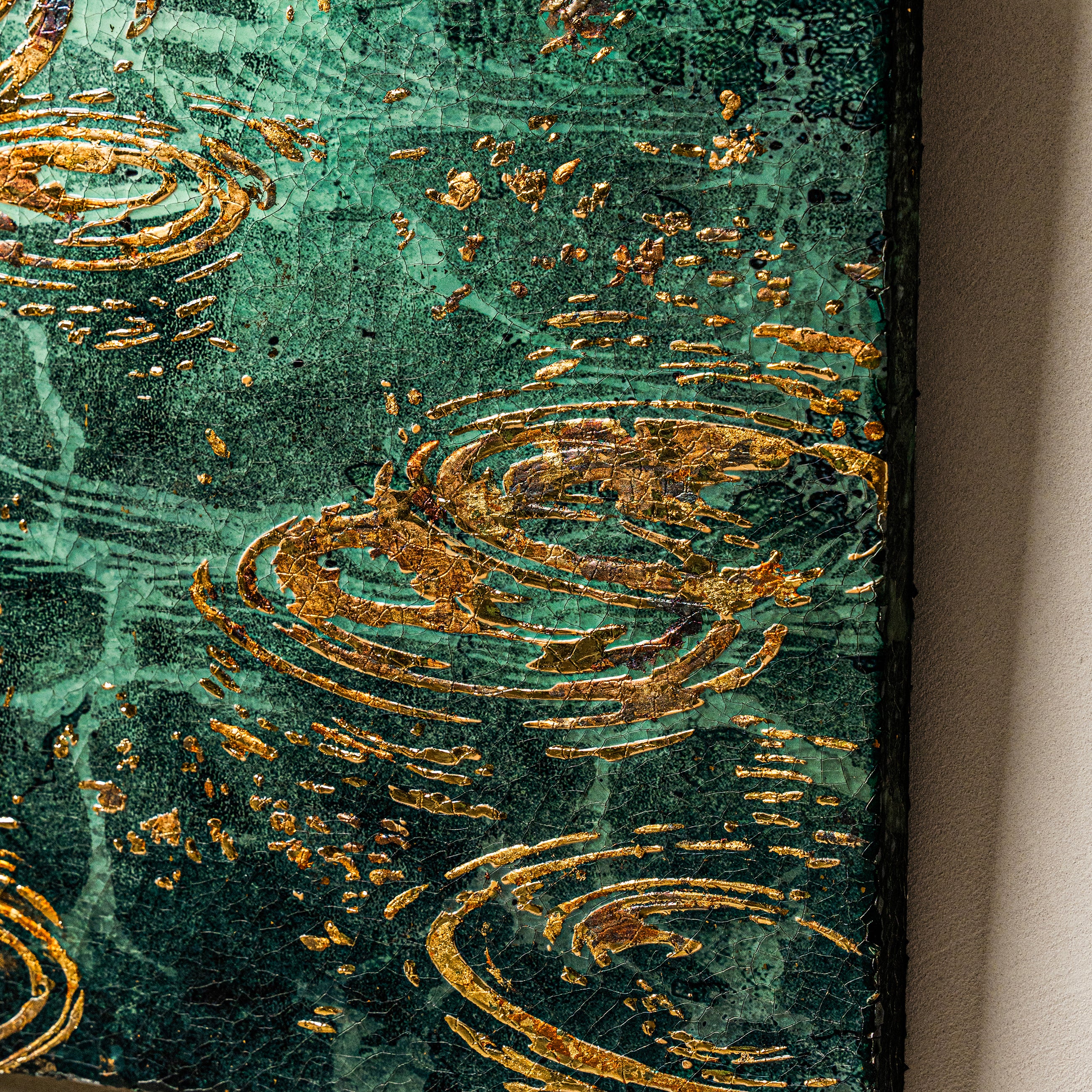 Right-center texture detail — patinated foil relief.