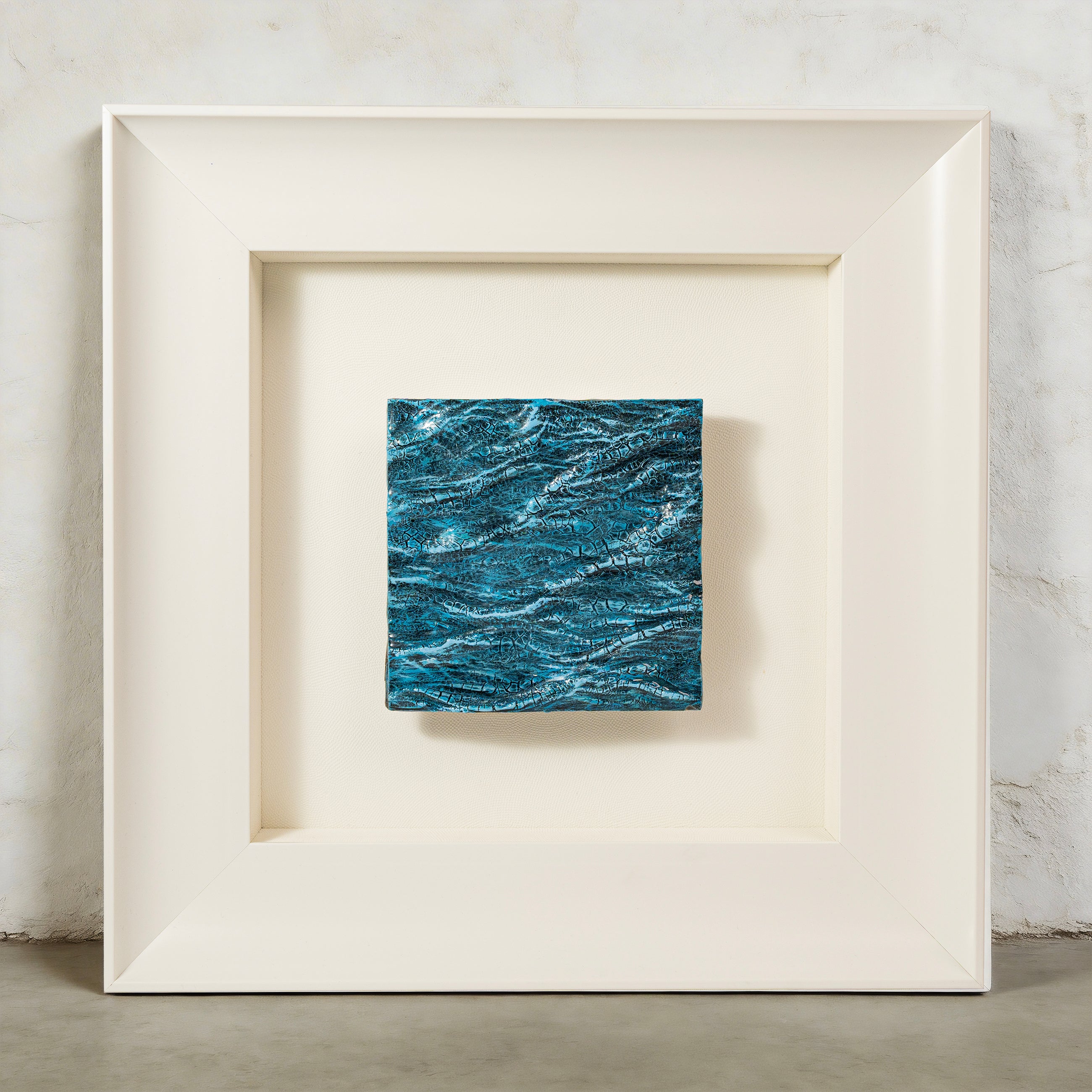 Pelagic — Mineral Texture · Aura Frame, full view of a water element wall art where seven to nine hand-painted passes build a deep navy-to-crystal gradient across a 3D wave relief mineral texture, evoking light penetrating ocean depth layer by layer.