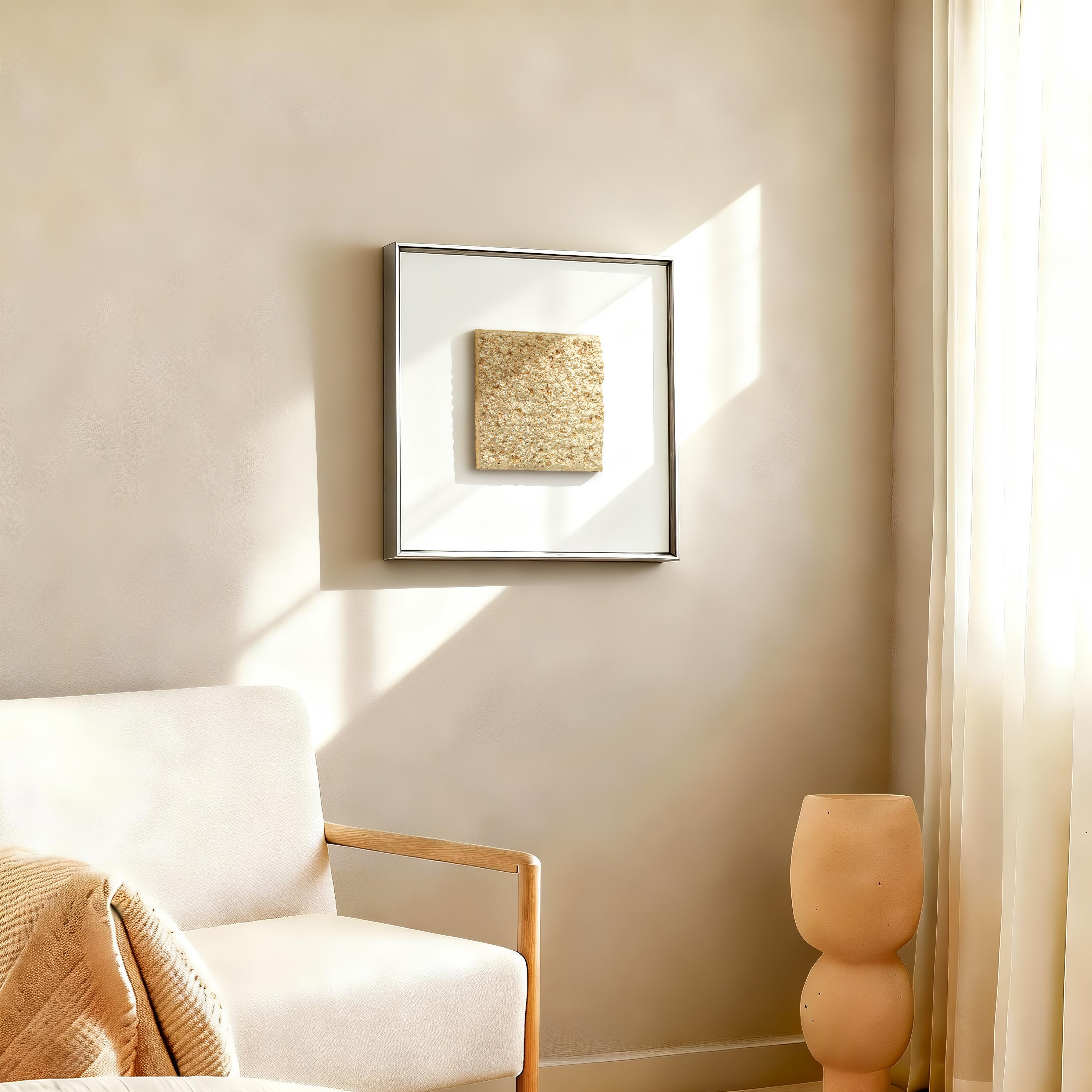 Solstice — Gilded Foil · Aura Frame displayed in an interior setting, its fire element energy and richly textured 3D mineral surface — gilded peaks catching light while valleys hold warmth differently — bringing the luminous presence of a sunlit mountain range to the wall.