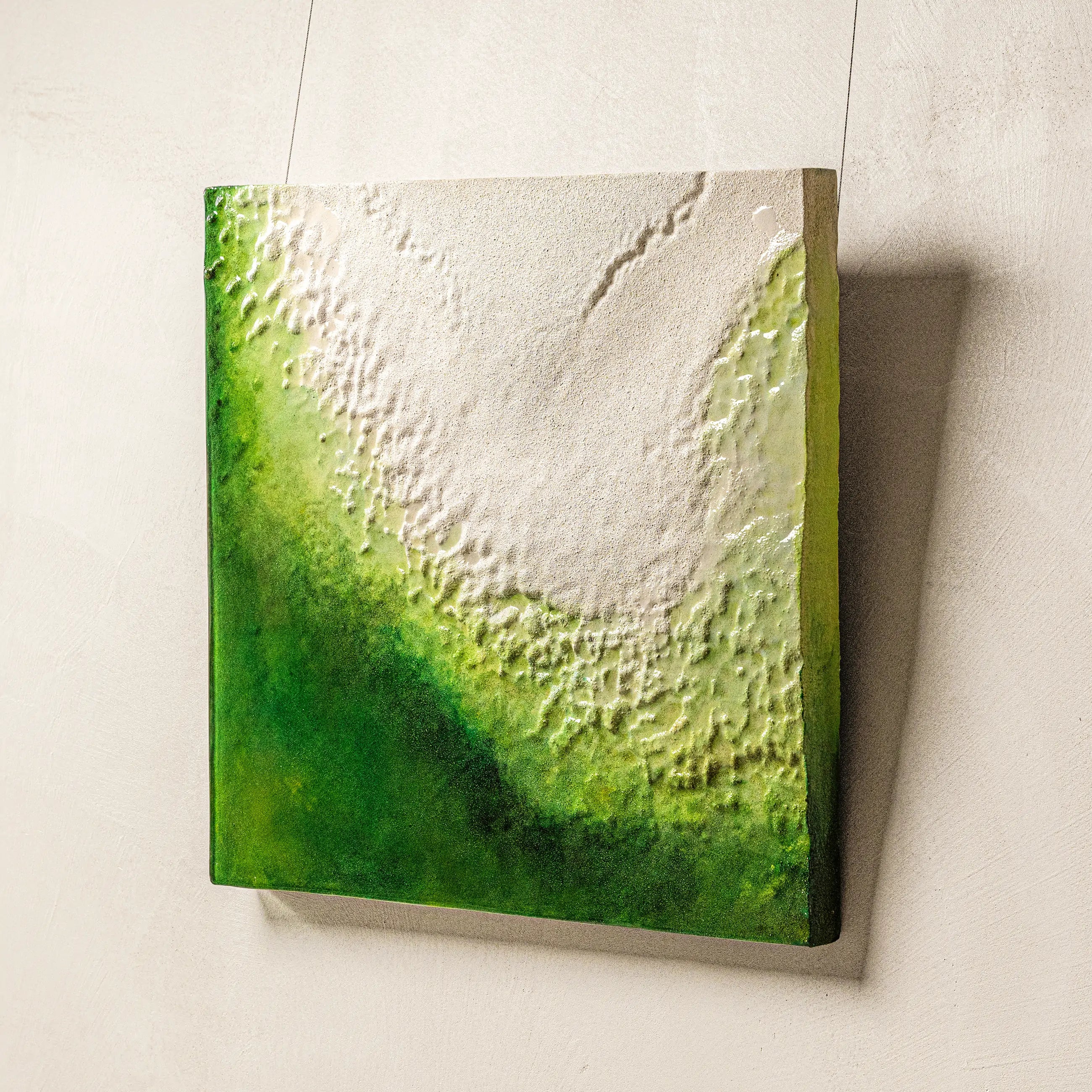 Macro detail of The Frozen Spring of Life's sculpted surface, revealing the luminous transition of verdant greens into pure white and the visual depth of its 3D textured mineral layers.